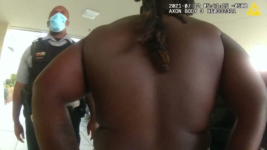 A deputy behind Leonard Holmes moments before he ran