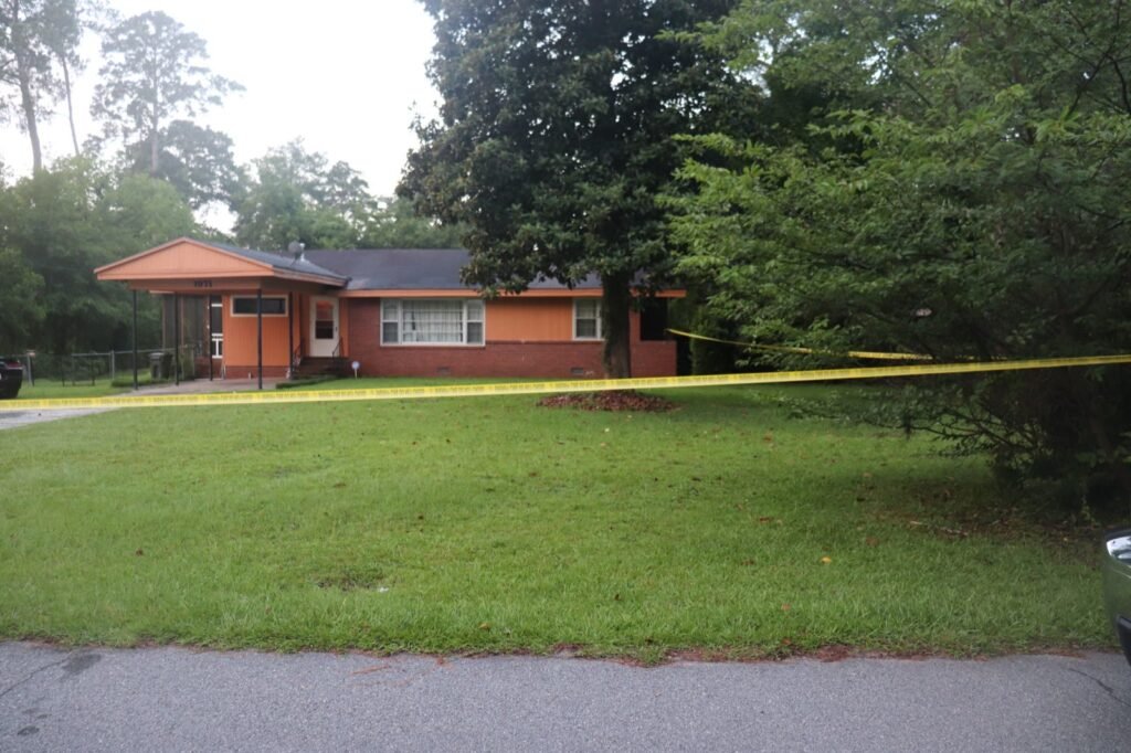 Crime scene tape outside the home on Karen Drive in Macon